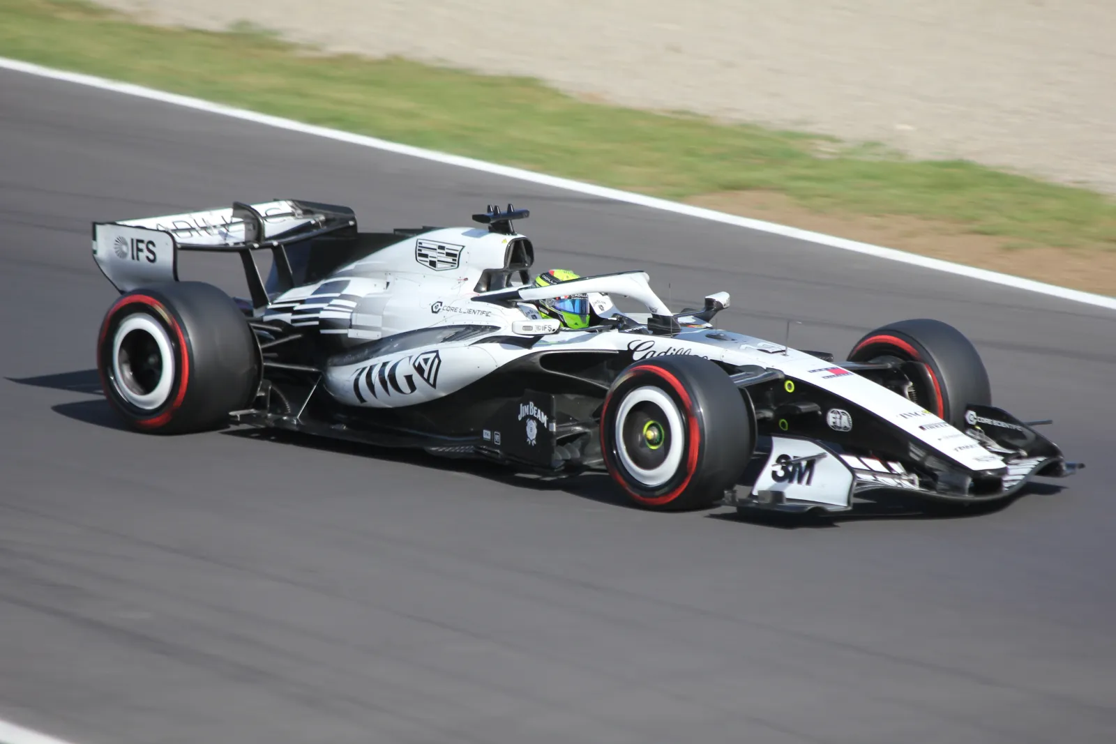 Sergio Perez's white Cadillac Formula 1 car cornering at Monza during 2026 qualifying
