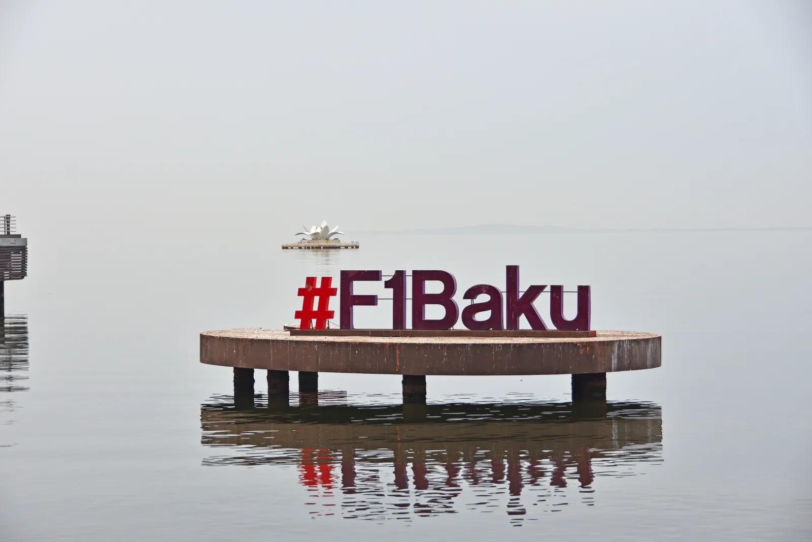 The hashtag F1 Baku sign standing in the Caspian Sea off Baku Boulevard