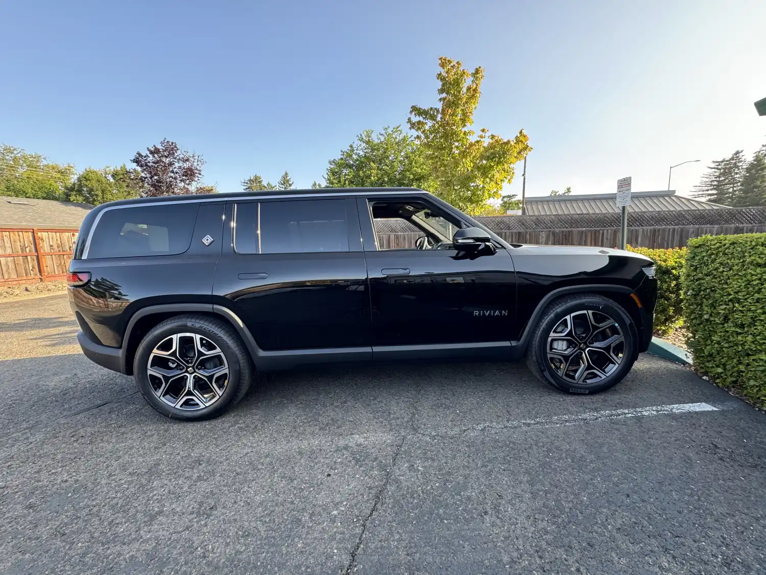 A Rivian R1S parked in Sonoma, California, showing its three-row full-size body