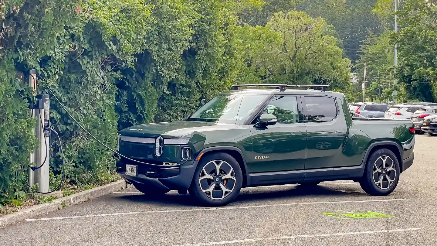 Rivian R1T at a public charger: is there still an EV tax credit in 2026