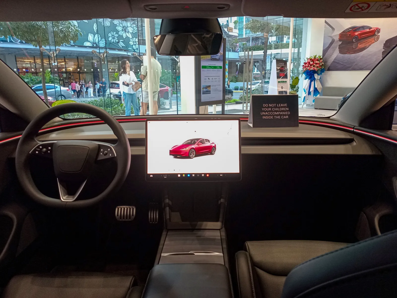 Tesla Model 3 minimalist cockpit interior showing steering wheel and center display